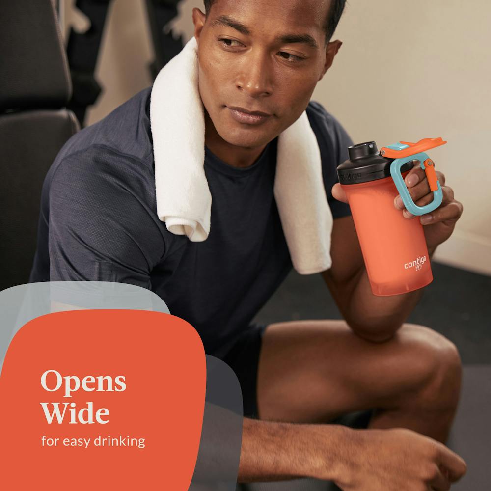 Man in gym holding shaker bottle