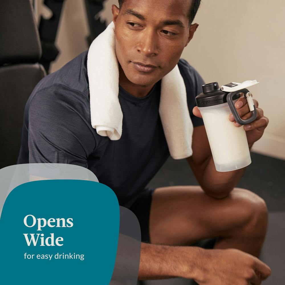 Man in gym holding shaker bottle